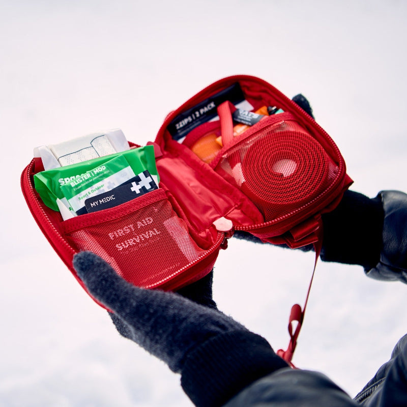 Tactical backpack with multiple compartments for outdoor survival and emergency preparedness.