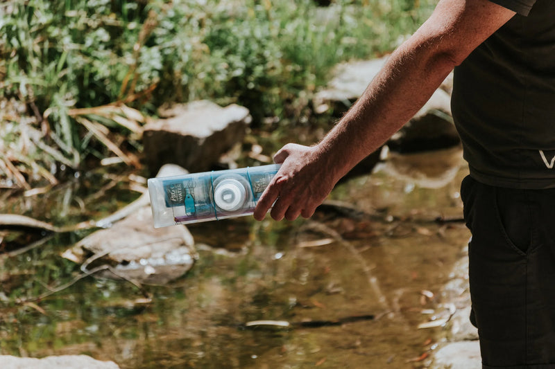 Portable water purification bag for outdoor survival and emergency preparedness, labeled "Puribag".