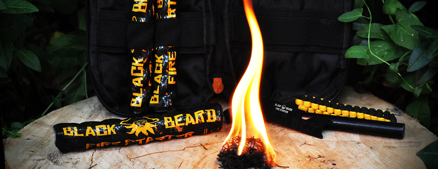 Outdoor survival gear assortment including tactical backpack, compass, and emergency tools on rugged terrain.