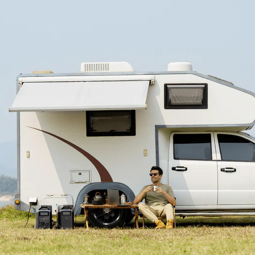 Camper using EcoFlow solar generator for off-grid power in outdoor setting, ideal for survival and emergency preparedness.