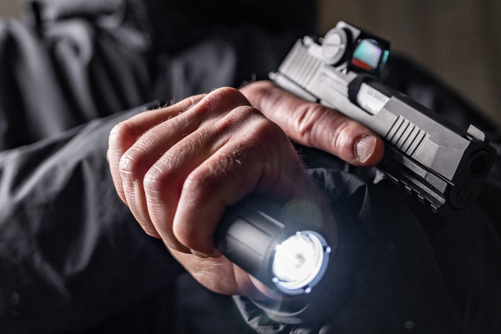 Tactical EDC gear displayed on rugged terrain, featuring durable materials for outdoor survival and emergency use.