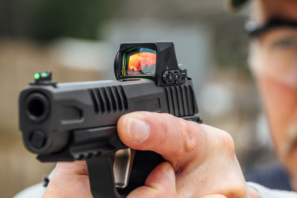 High-performance ROMEO-X tactical sight with enclosed design for enhanced durability in outdoor survival scenarios.