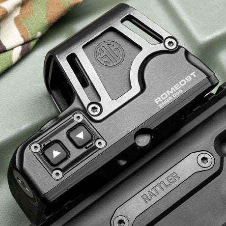 Tactical scope mounted on a rifle in outdoor setting, ideal for precision shooting and survival scenarios.