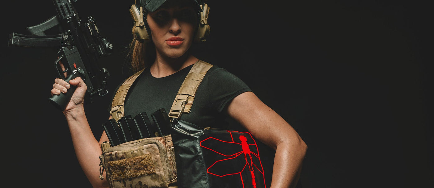 Haley Strategic tactical gear display showcasing outdoor survival equipment in a rugged environment.