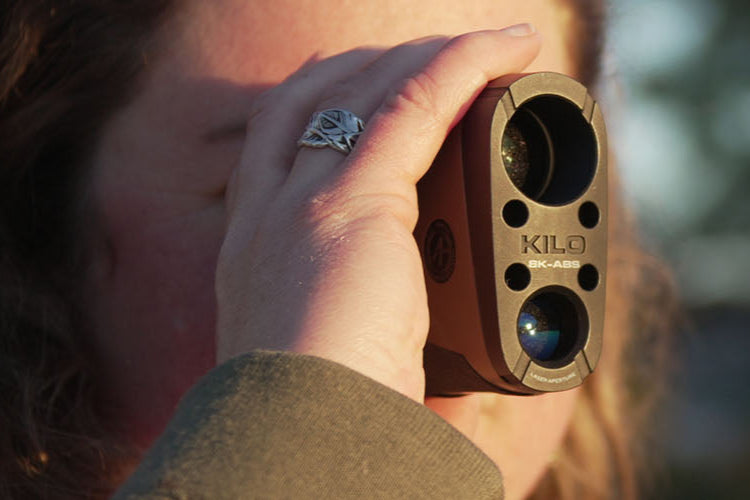 Handheld rangefinder for outdoor survival and tactical gear, ideal for precise distance measurement in rugged environments.