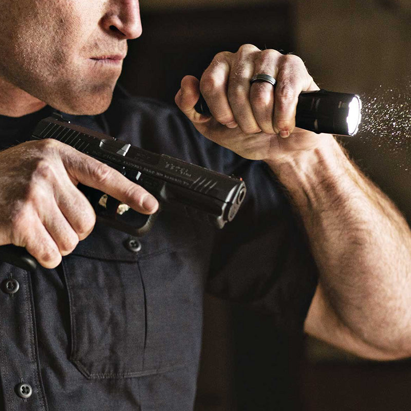 SureFire tactical flashlight for law enforcement, ideal for outdoor survival and emergency preparedness.