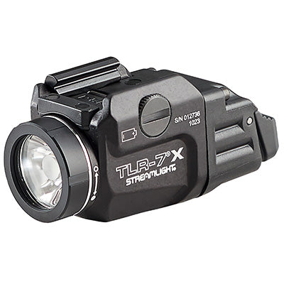 Compact tactical flashlight TLR-7-X for outdoor survival and emergency preparedness gear.