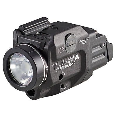 Compact tactical flashlight with laser sight attachment for outdoor survival and emergency preparedness.